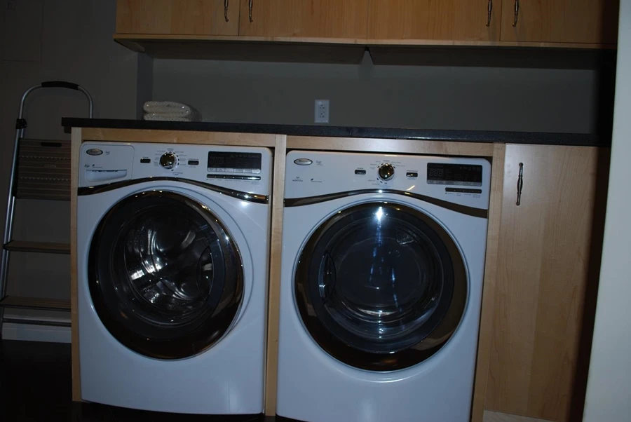 A washing machine and drier in one of the shelter condos