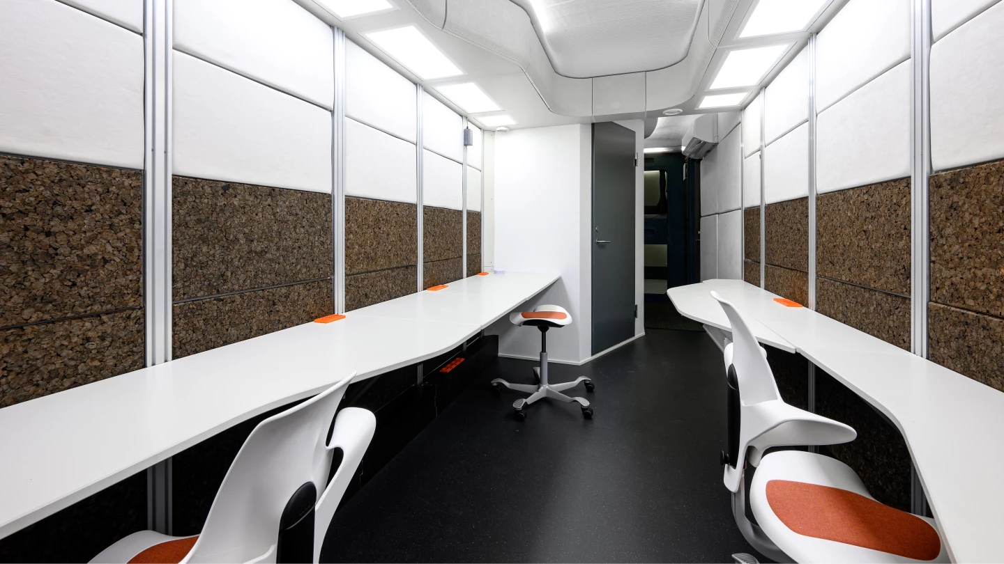 FLEXHab's laboratory area includes working spaces, communication equipment, and computers
