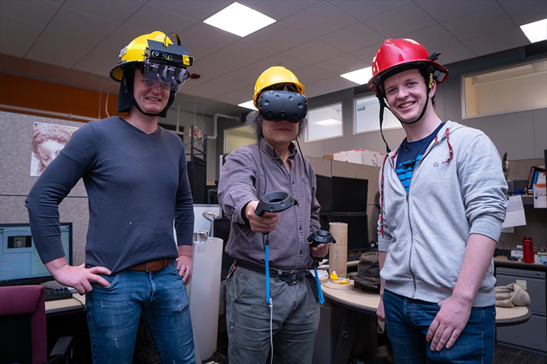 Researchers Florian Alber, Yang Cai, and Sean Hackett demonstrate Haptic Helmet prototypes