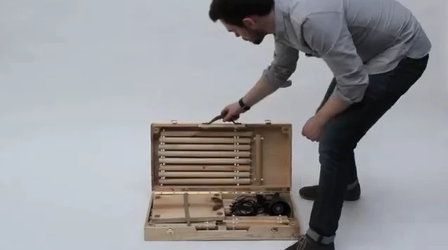 The kit easily opens up and can quickly be assembled to make a desk, two stools and lamp