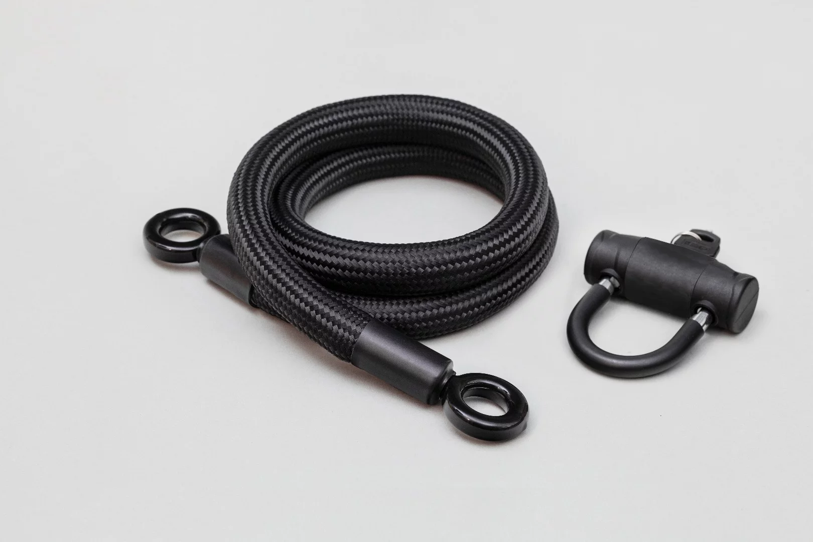 Tempered steel eyelets are located at either end of the tex-lock rope, which go through the shackle of an included mini U-lock or padlock