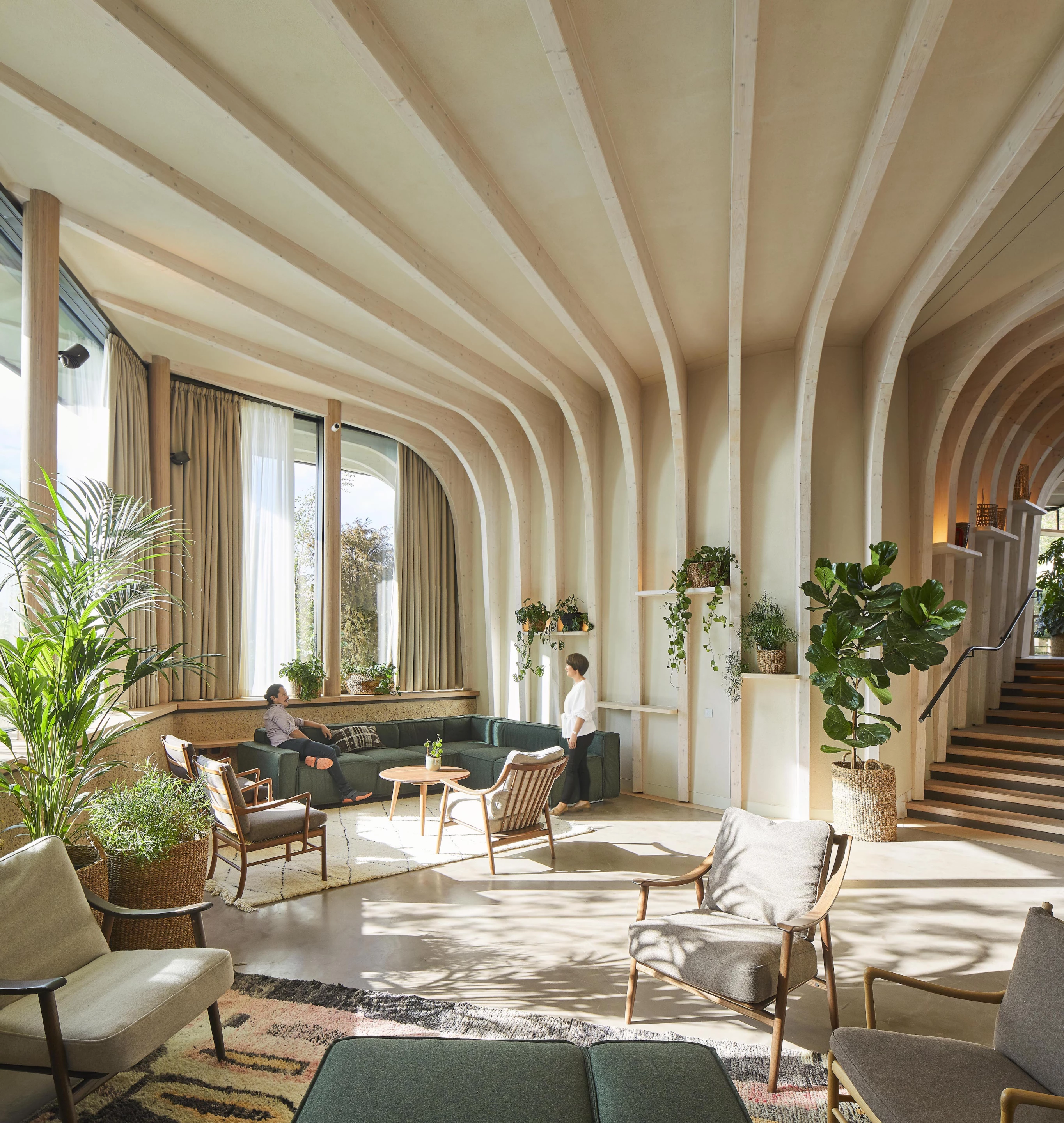 The interior design maximizes light and ventilation and makes use of natural materials like sustainably-sourced timber and cork