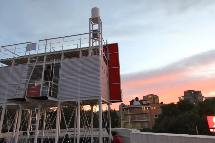 The Billboard House is a simple home built onto the back of a billboard in Mexico City to temporarily house an artist while she works on a new hand-painted advertisement