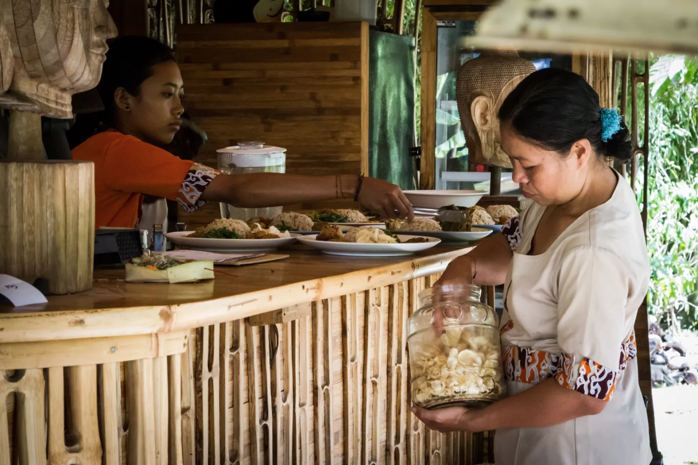Our tour began in the village's common area, where hospitality staff work with a hurried precision to prepare rice and noodle dishes for guests