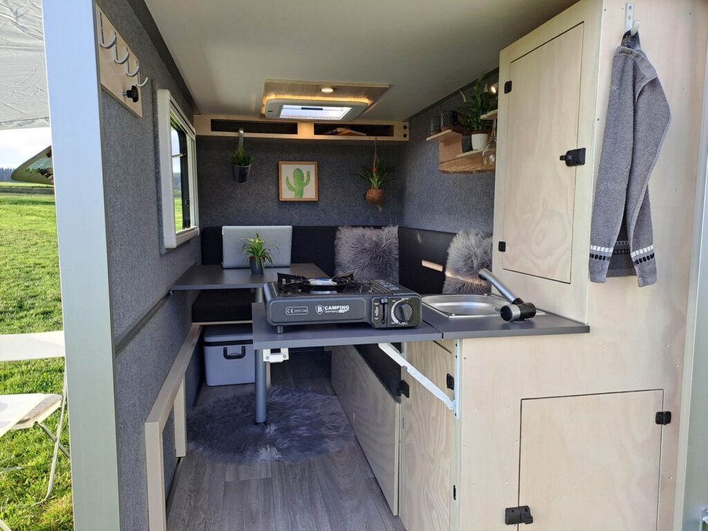 The kitchen's extendable worktop can hold the optional gas single-burner stove