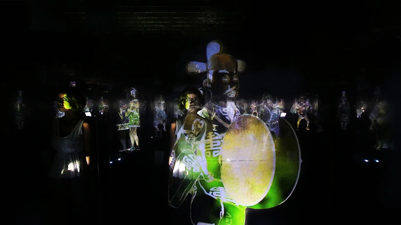 A Japanese man plays a musical instrument (Photo: TeamLab)