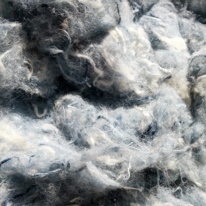 The raw recycled denim, which is also used for building insulation