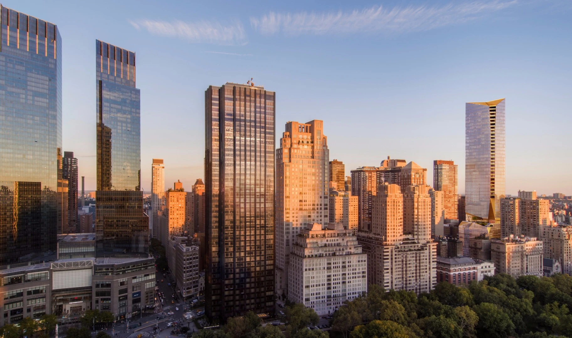 The tower to be constructed at 50 West 66th Street, seen on the right, will be finished in limestone, bronze and glass