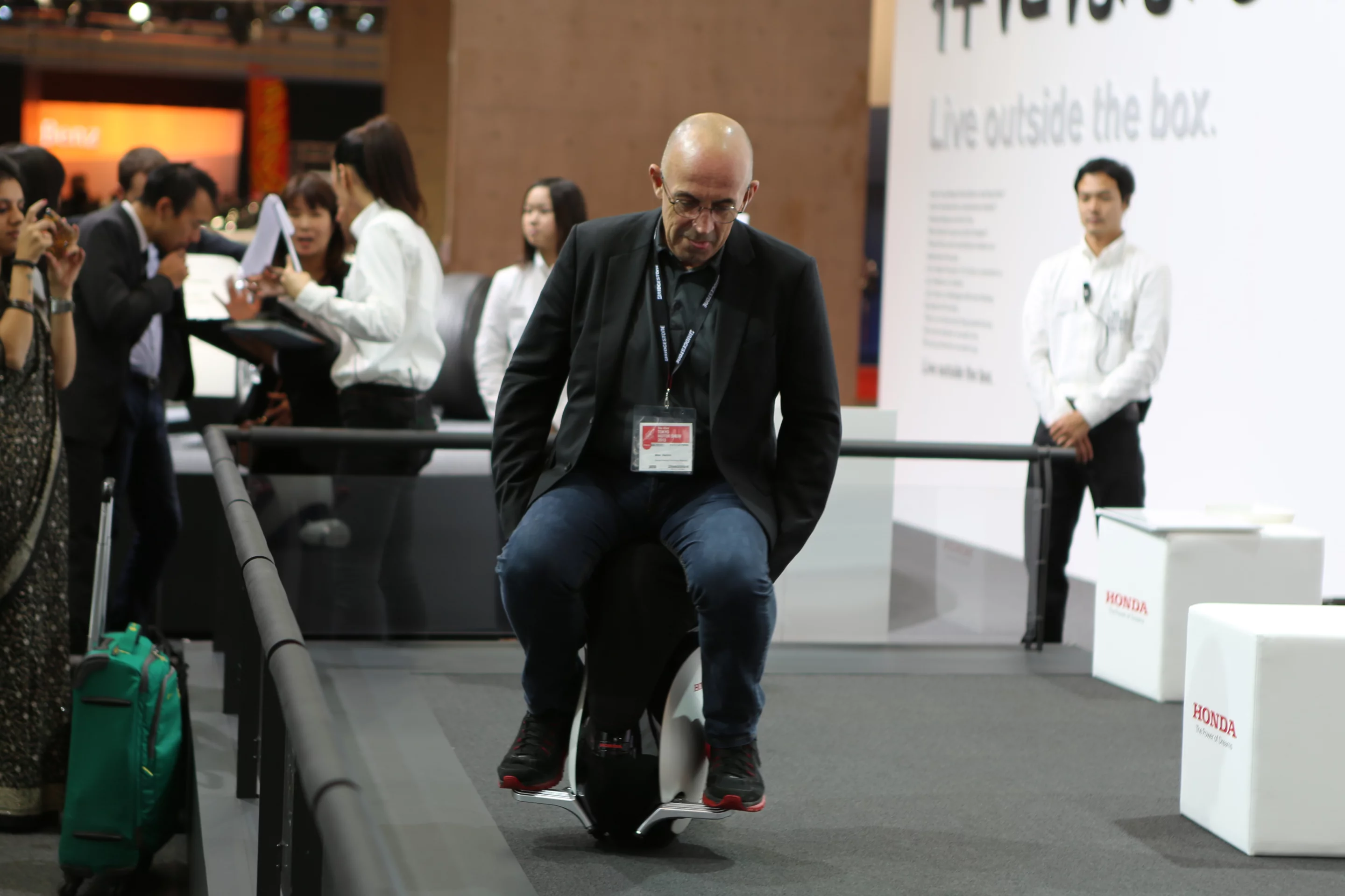 Riding Honda's UNI-CUB β (Photo: Stephen Clemenger / Lets C Design)