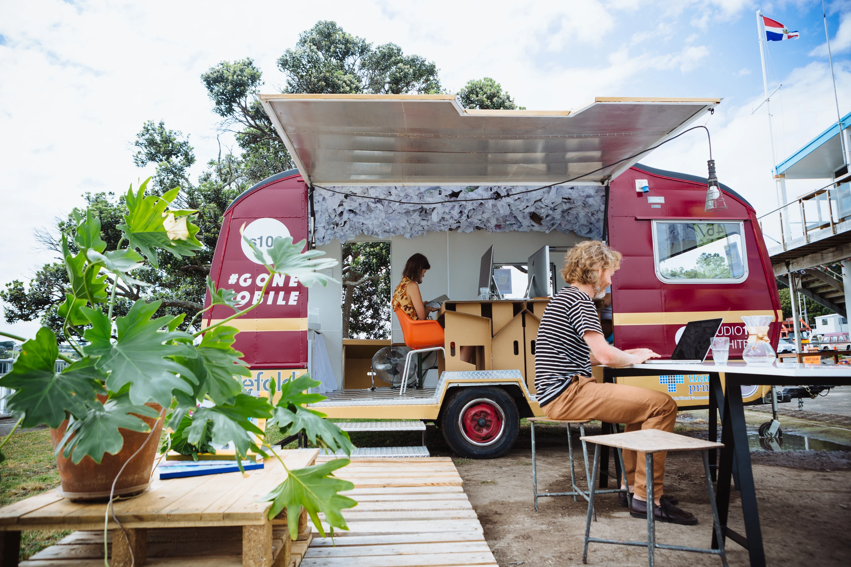 The overall layout and design of the mobile office includes a couple of "break-out" zones