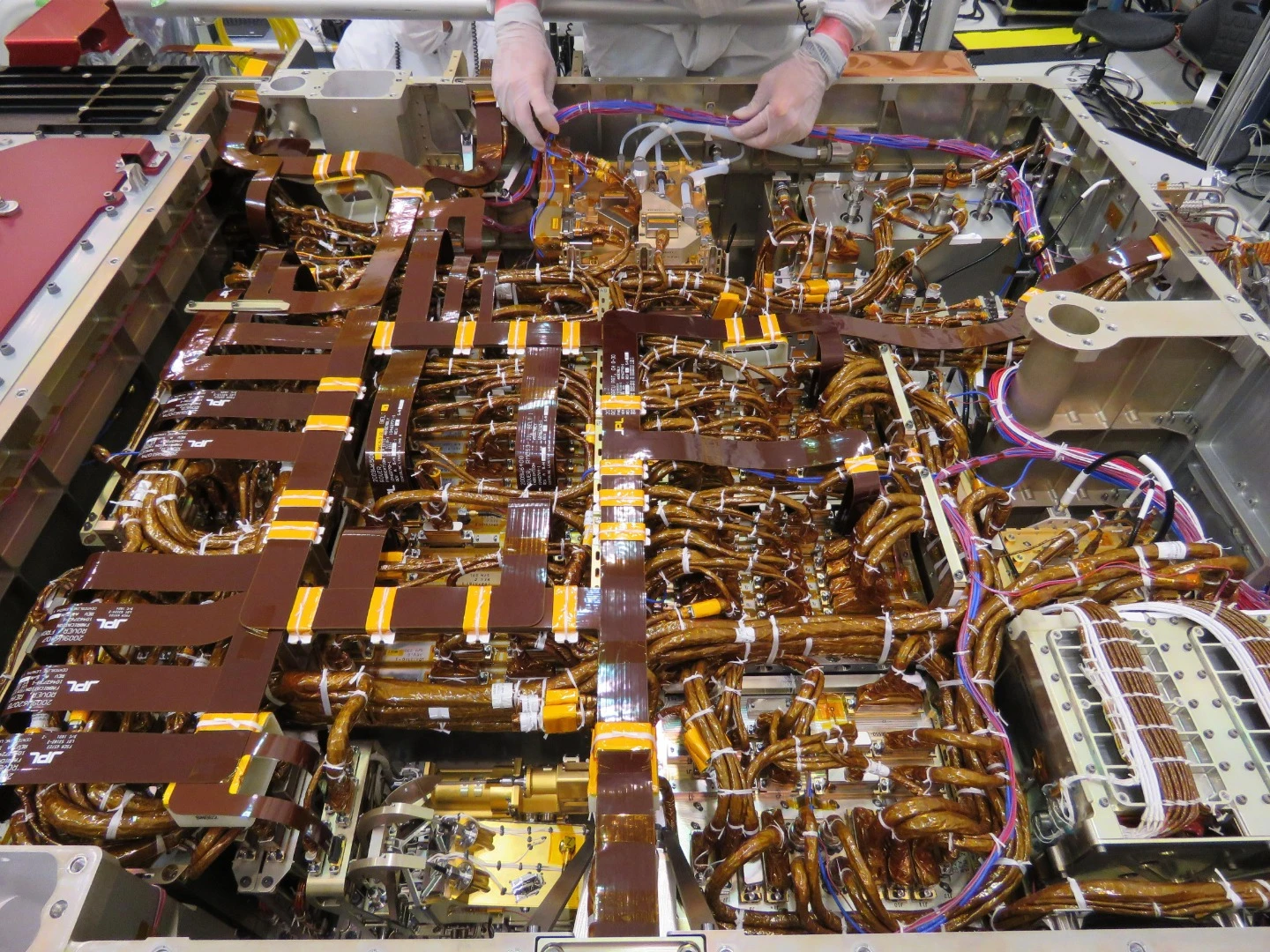 The wiring in the belly of the Mars 2020 rover