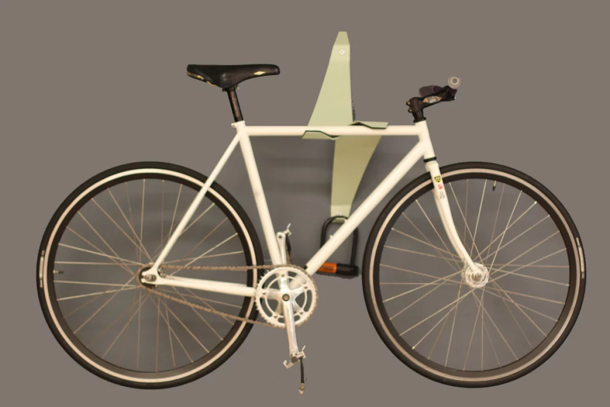 The Bike Valet is a bicycle wall storage device that uses a cantilevered design to hold bikes in place