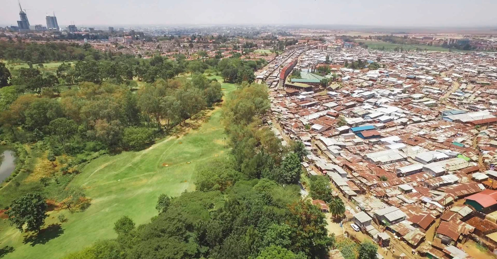 The slum of Kibera sits alongside a golf course in Nairobi