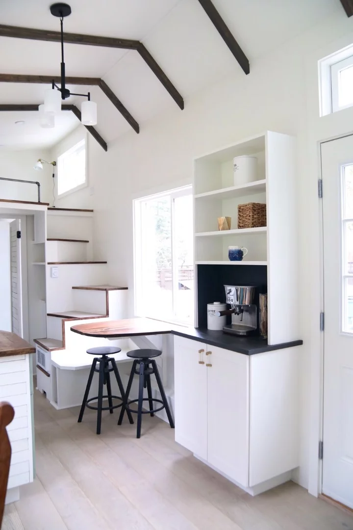 The Coastal Craftsman features one bedroom, accessed by staircase