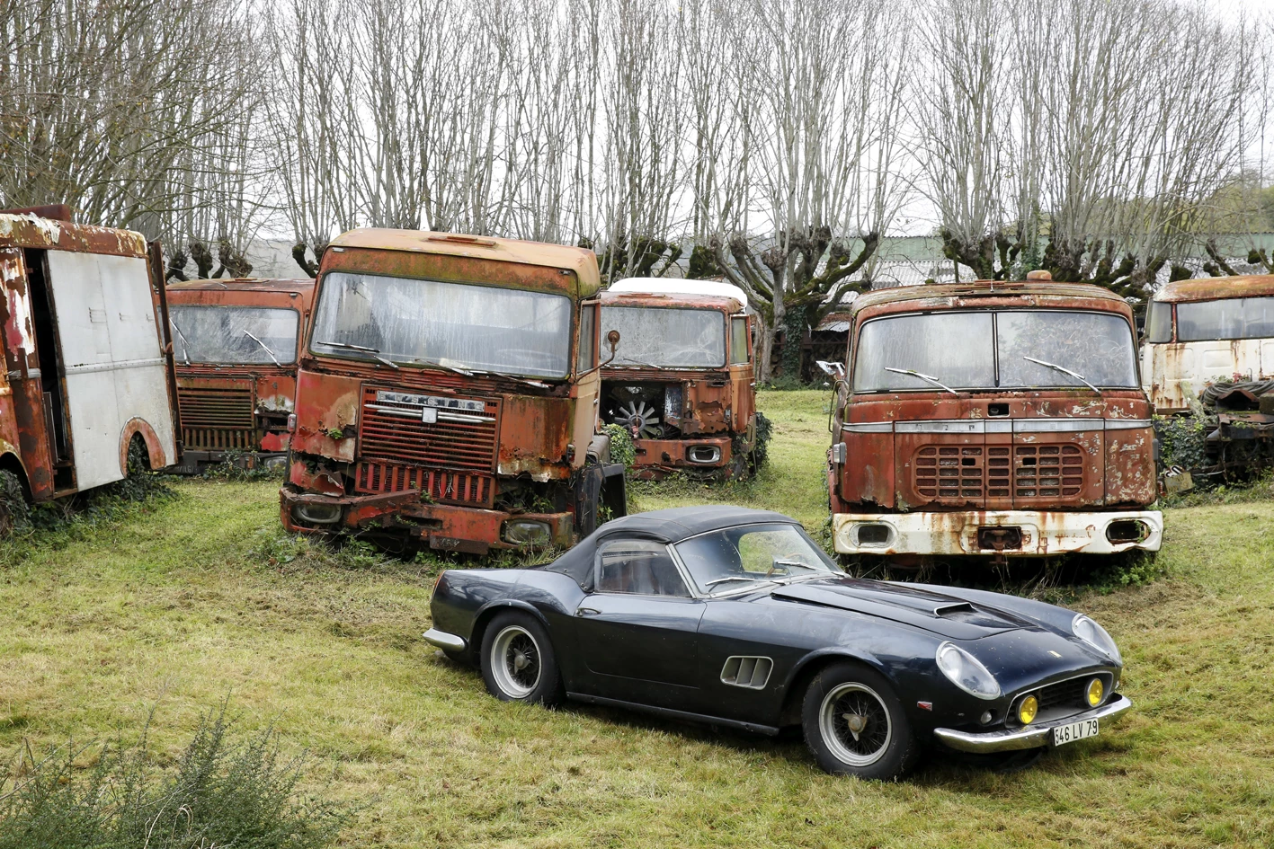 The Ferrari 250 GT California SWB Spider from the Baillon Collection sits among relics from Baillon's booming transport business of five decades ago © Artcurial
