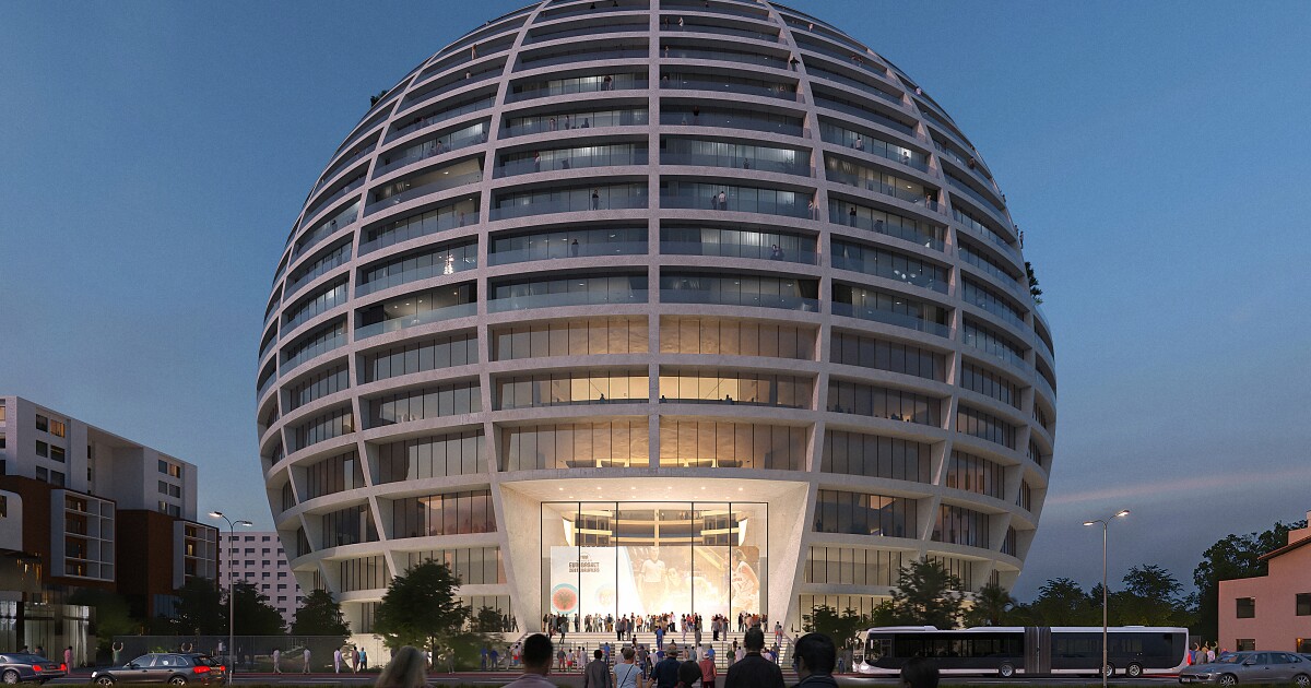 A huge spherical building stacks apartments above a sports arena A huge spherical building stacks apartments above a sports arena