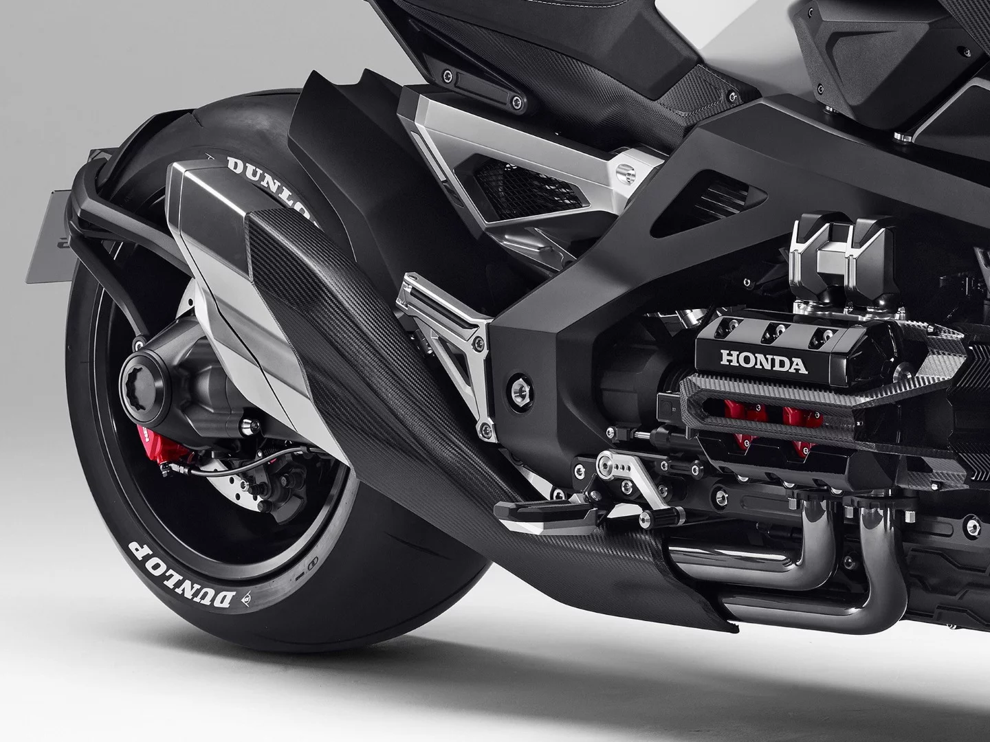 Honda's Neowing couples a four-cylinder boxer engine with electric motors, transmitting the output to the rear wheel via a shaft