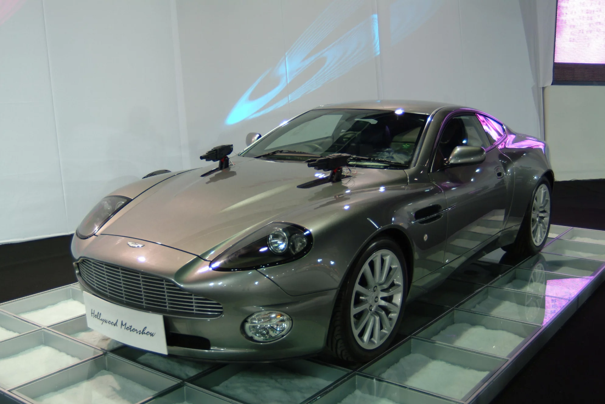 James Bond returned to driving Aston Martins after a break of 15 years when Pierce Brosnan's '007' got behind the wheel of a 2002 V12 Vanquish supercar for the 2002 Bond film Die Another Day. Aston Martin supplied three finished 2002 V12 Vanquish cars - chassis numbers '172', '173' and '174' - to become 'hero' cars which would be used for all the close-ups of Pierce Brosnan as James Bond. This car is chassis number '172', the main 'hero' car. Owned by Aston Martin and never registered, it became the Vanquish out of the three production versions supplied that was used for most of the close-up shots. Whenever Bond is seen in the film near to, or sitting in, a Vanquish, that car is more likely to be '172'. It was sold by Bonhams in London in May, 2003 for GBP£210,500 (US$221,921)