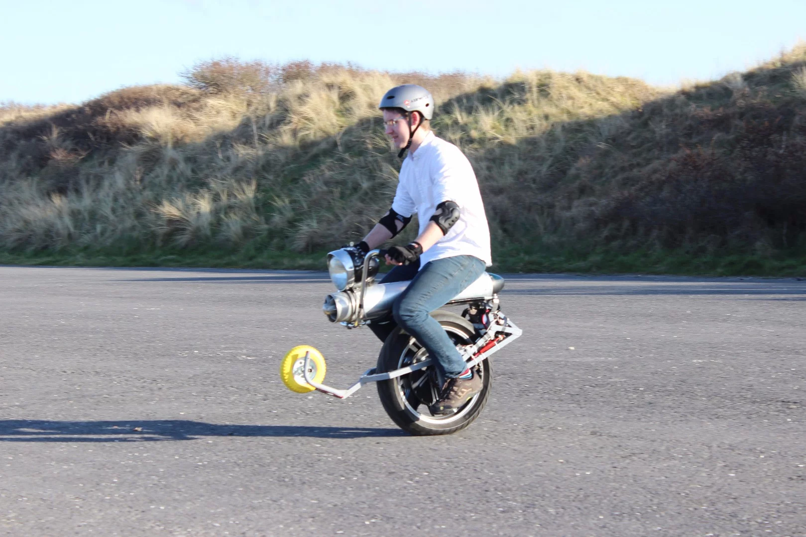 Fellow tinkerer Nick Thatcher riding John Dingley's self-balancing electric unicycle