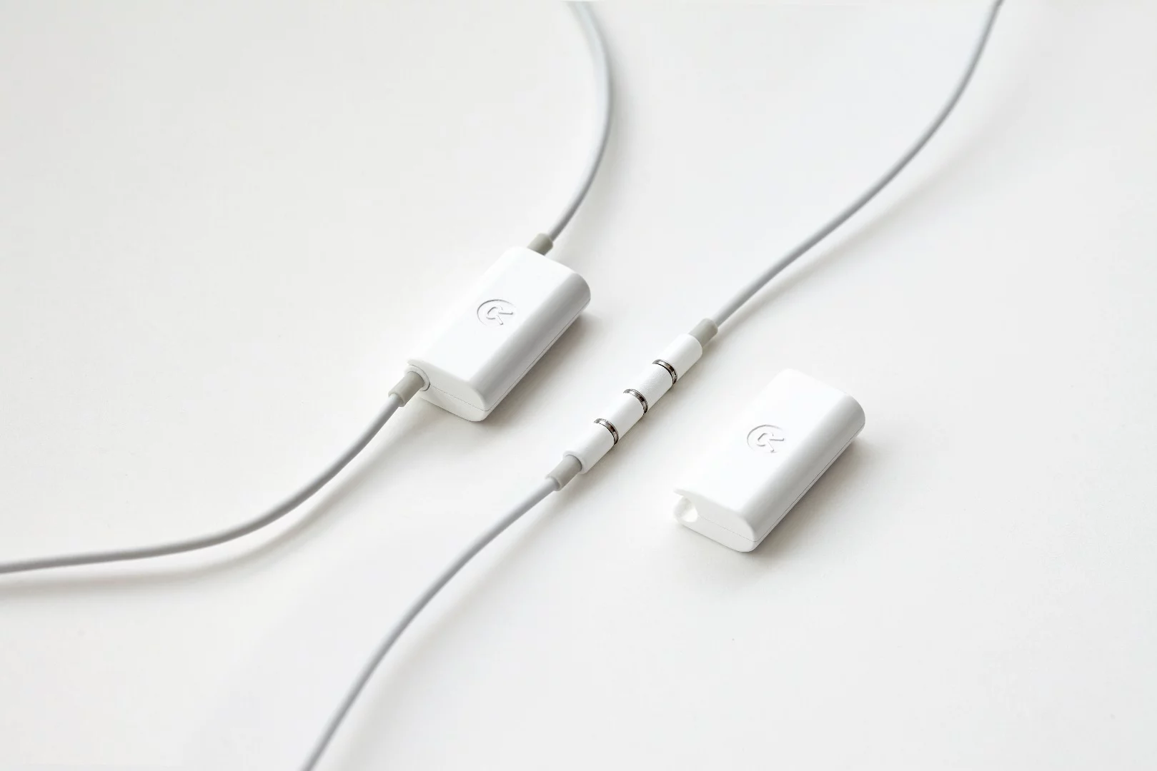 The mid-cable battery is charged by clipping the supplied cable to the earphone wire and plugging the other end into a spare USB port or charging plug