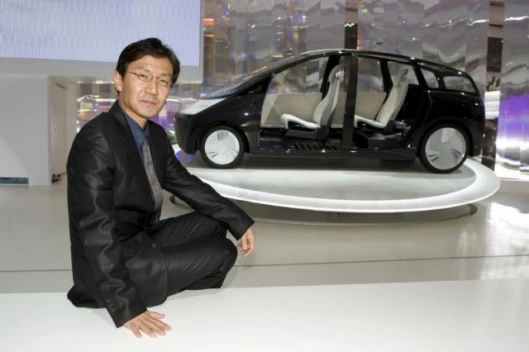 The Toyota 1/X concept car with project manager Tetsuya Kaida.