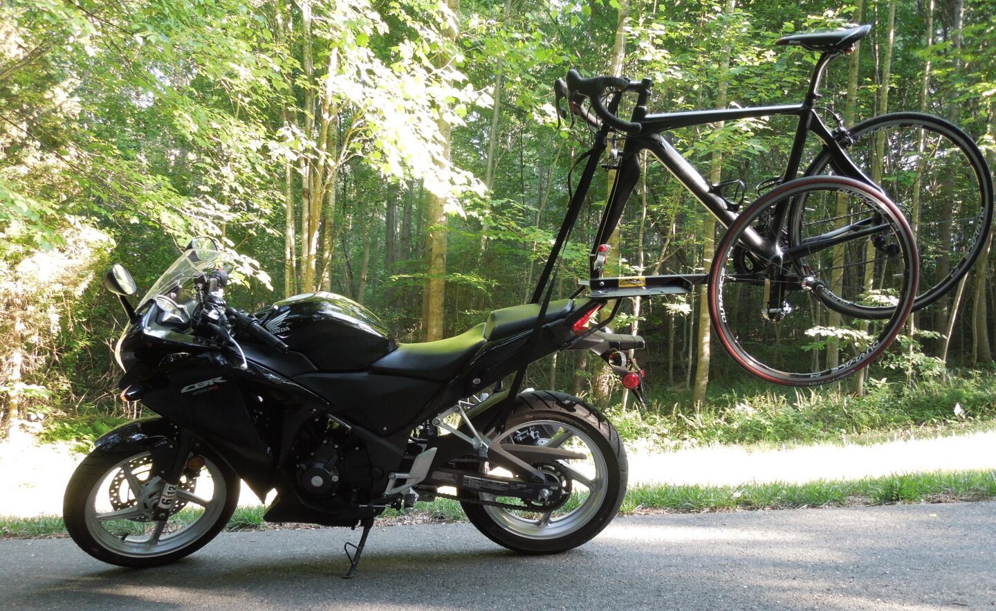 The 2X2 Cycles Motorcycle Bicycle Rack has a locking fork mount, so the motorcycle and bicycle can be left unattended