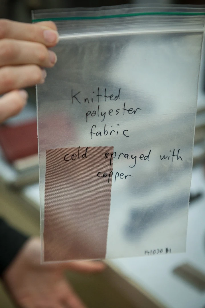 Fine, knitted polyester fabric that has been coated with copper using cold spray technology. The piece remains totally flexible.