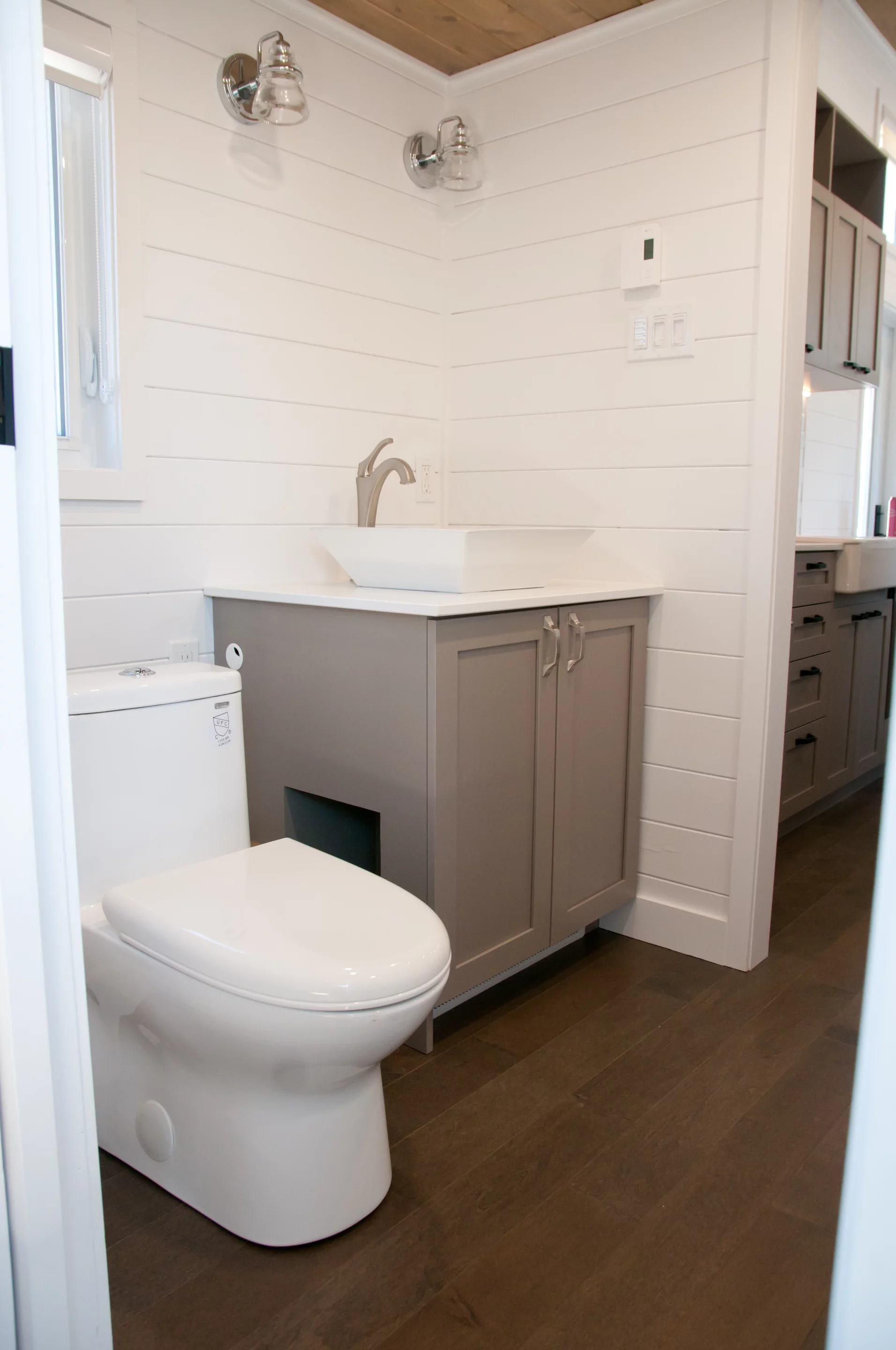 The Magnolia V6's bathroom features a flushing toilet
