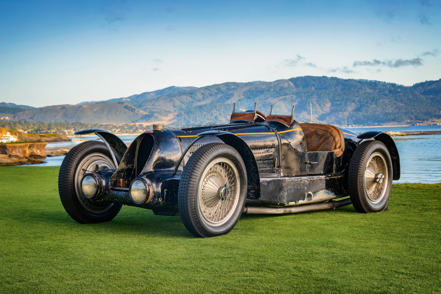 This battle-scarred geriatric has a lot in common with Grandpa's axe and presents as a most unlikely entrant in a beauty contest. It began life as a Grand Prix car and was raced for many years, then converted into a road car for a family friend. Grandpa was Ettore Bugatti. The family friend was King Leopold III of Belgium. It made history as the first preservation-class car to win "Best of Show" at Pebble Beach in 2024.