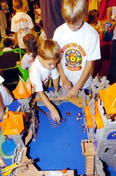 Tommy Walker (left) and Michael Unrenkoff play with the Toy of The Year, The Knight's Empire Castle from Playmobil when FamilyFun Magazine announced the top ten winners of their 14th annual Toy of The Year Award. Image: Gina Gayle/U.S. Newswire