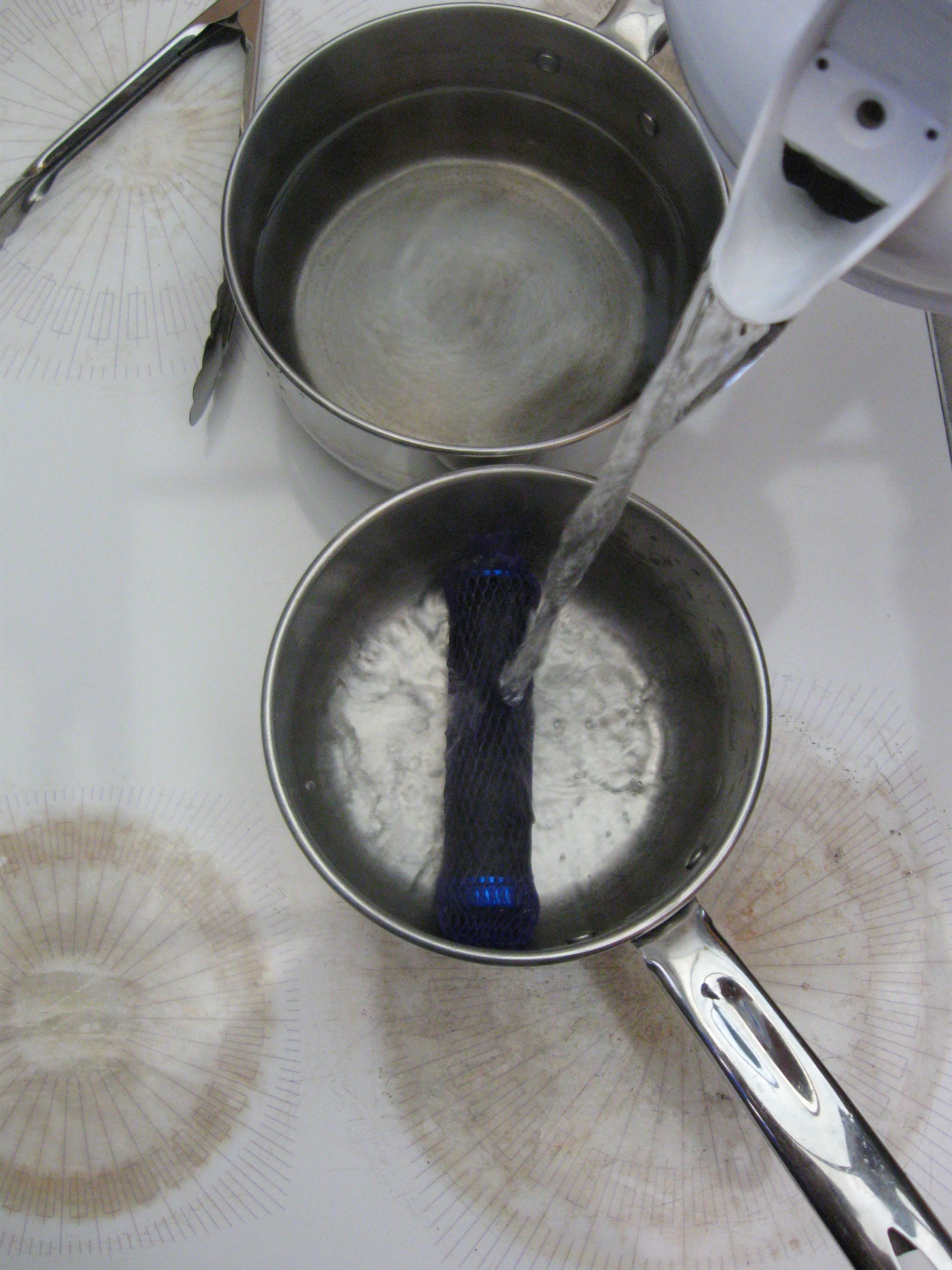 Pouring boiling water on the grips, at the start of the molding process