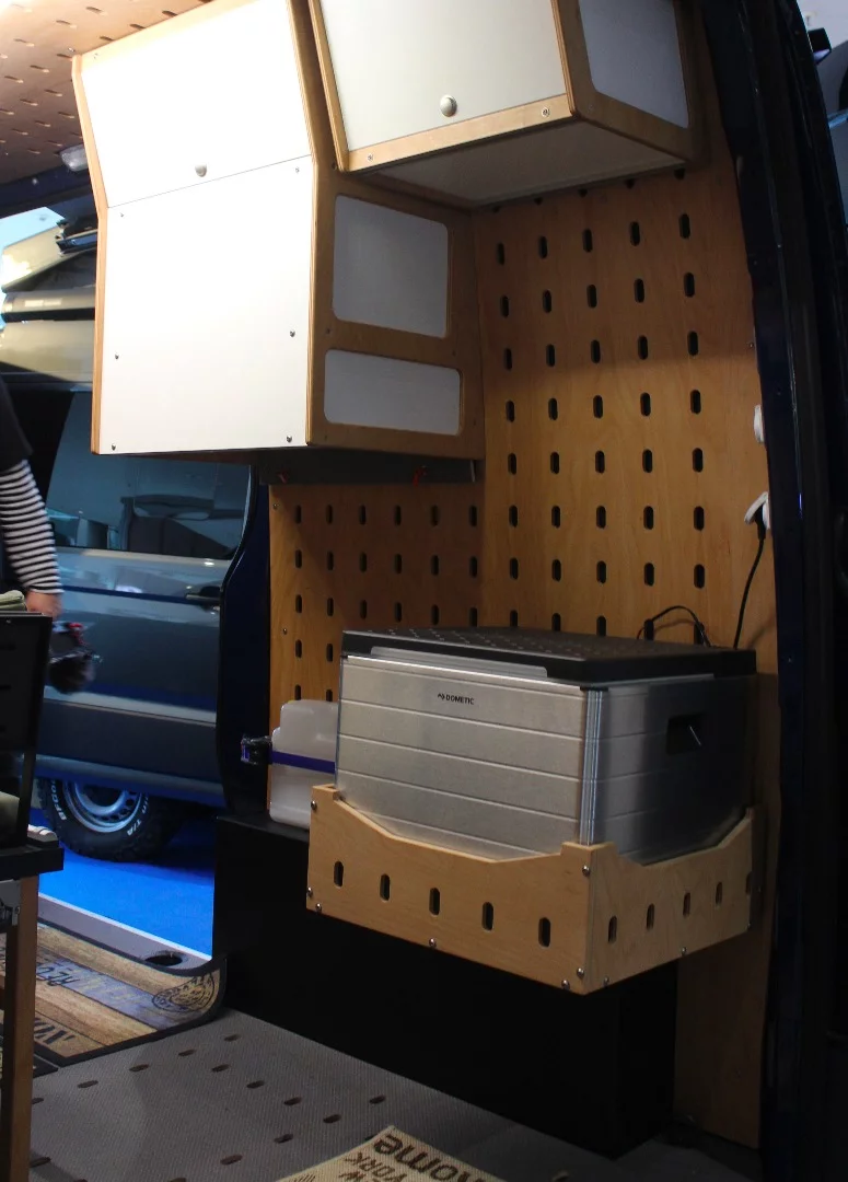 The Cargo Camper City Mercedes Sprinter on show has a different style of refrigerator but the same style of upper cabinetry kitchen