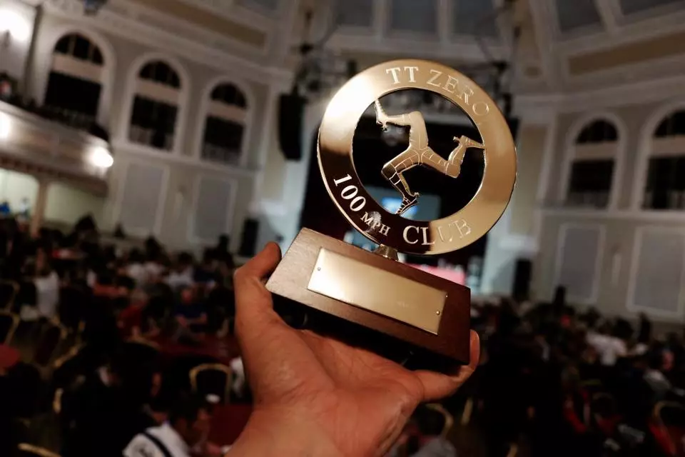 Team Sarolea proudly display an important trophy they take home from the 2015 TT Zero Challenge: A full membership to the 100 mph Club