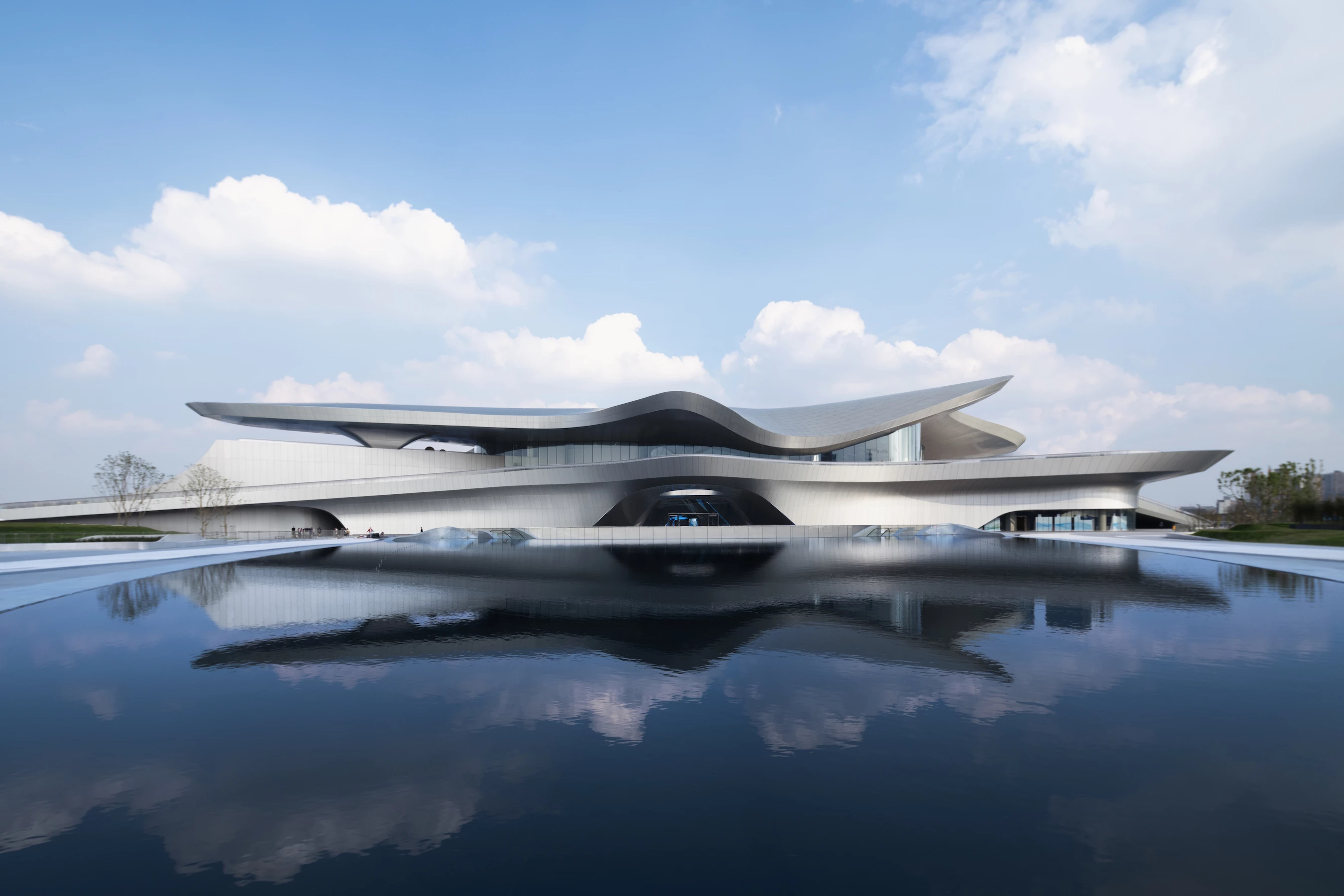 The Chengdu Science Fiction Museum's large sculpted roofline hosts solar panels, which reduce the building's electricity draw on the grid