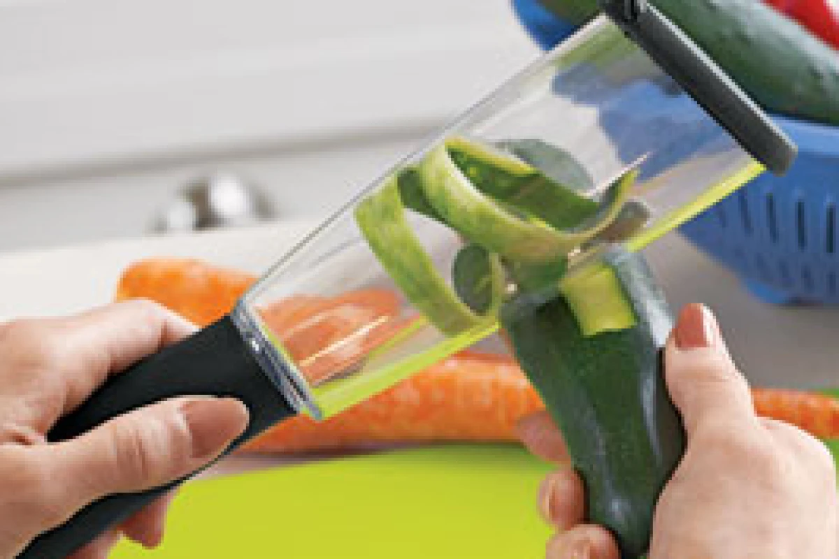 The Veggie-Peel traps and stores messy peel for easy disposal