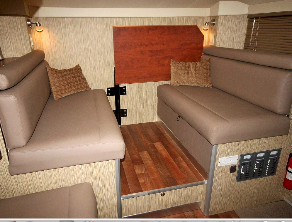 The table folds out of the way for bed conversion