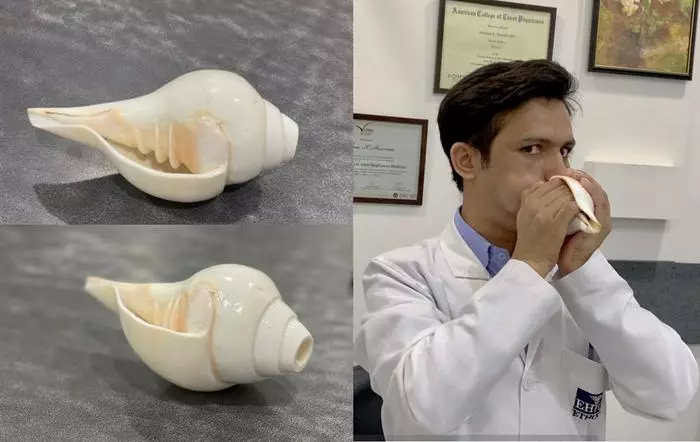 One of the researchers demonstrates the conch blowing method