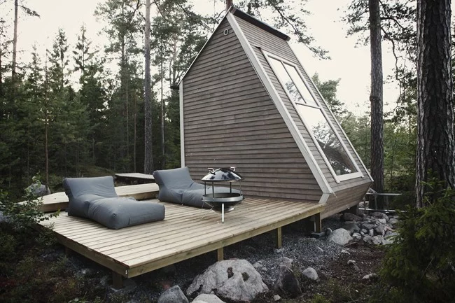 The standout feature of the Finnish micro house, by designer Robin Falck, is the fact that it is so small that it can be built without a permit in its native country of Finland