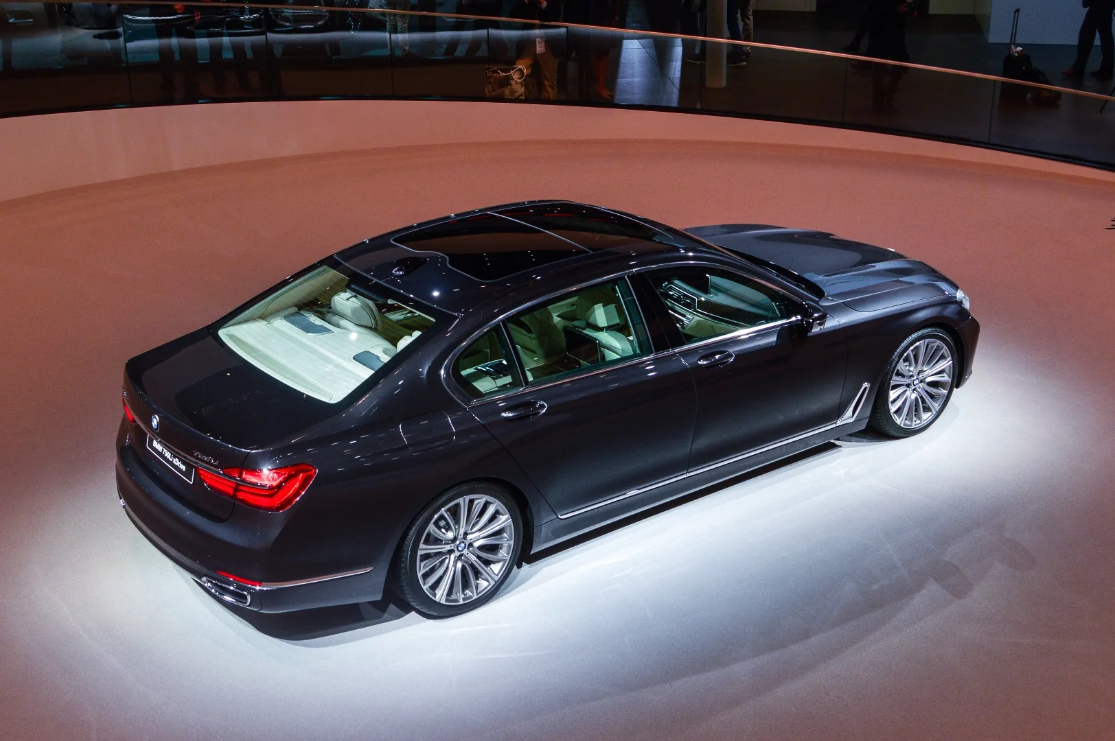 BMW's Frankfurt hall is a massive affair; this 750Li xDrive is spotlighted in a well inside the spiraling staircase leading to more displays upstairs