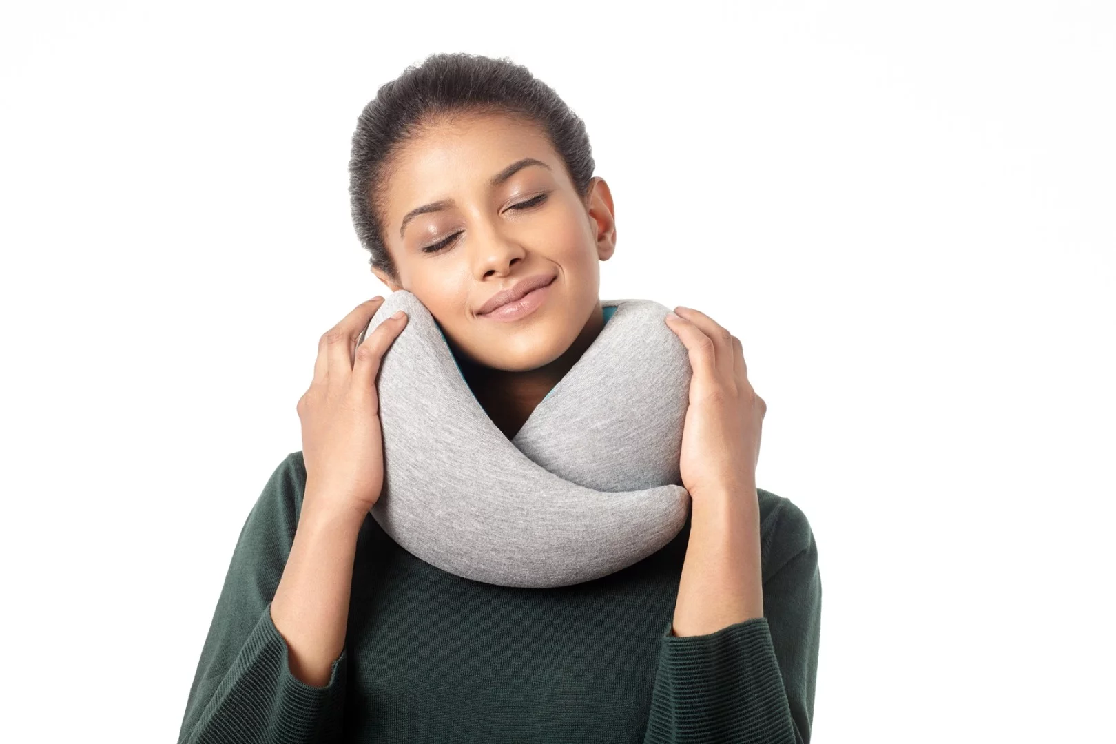 The Ostrich Pillow Go uses a memory foam interior to support the wearer's head
