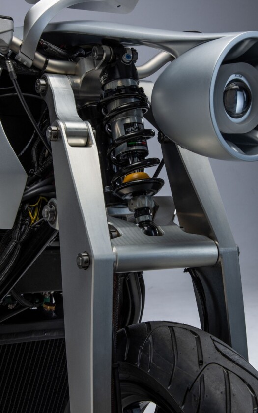 Ethec electric motorcycle: headlight hangs on a sexy extension from the main bodywork, between girder forks and a front monoshock
