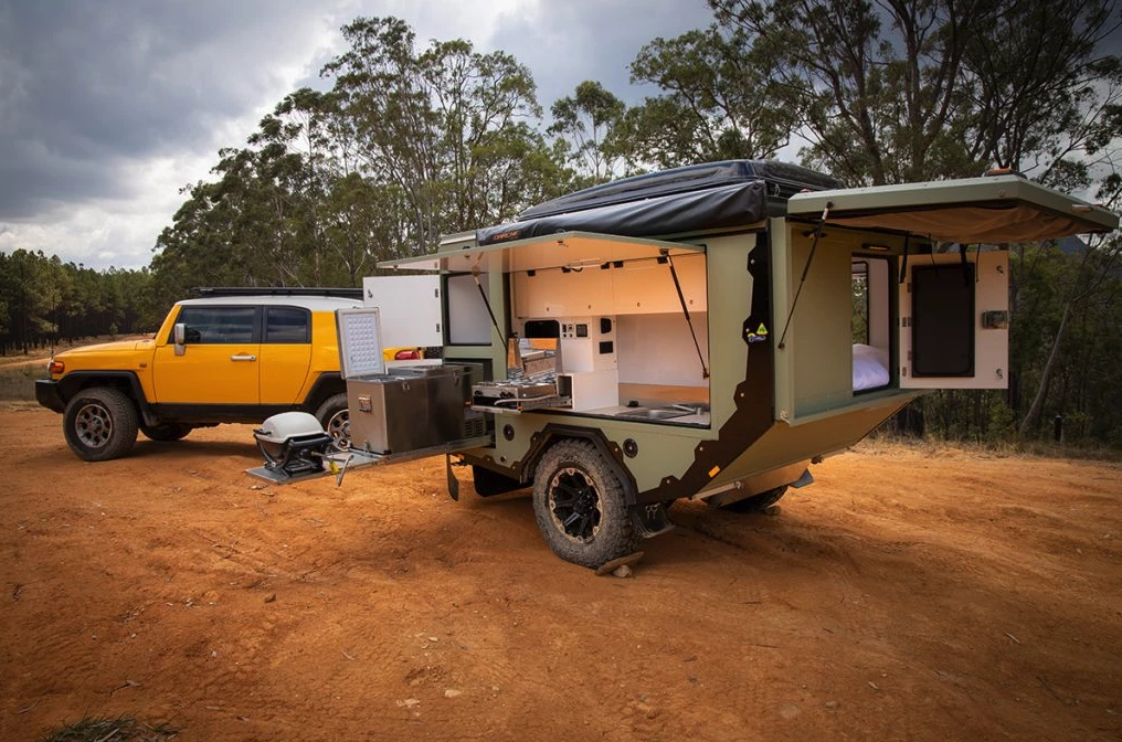 AOR shows the kitchen equipped with a dual-burner stove, fridge/freezer and portable grill