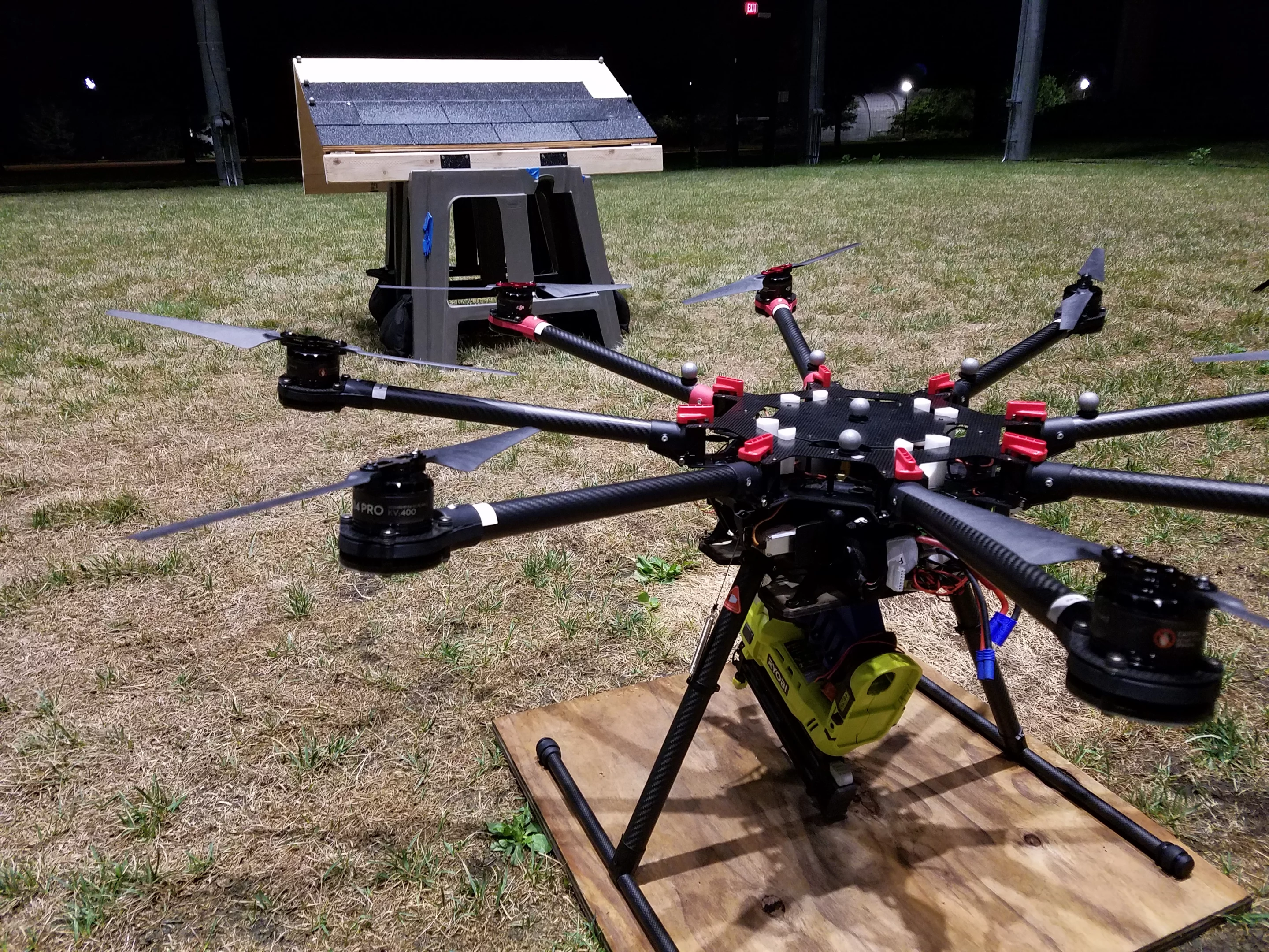 To turn the drone from one that simply carries a nail gun to one that uses it to secure roof shingles, the UM team set up a system of cameras and markers to help it find its way