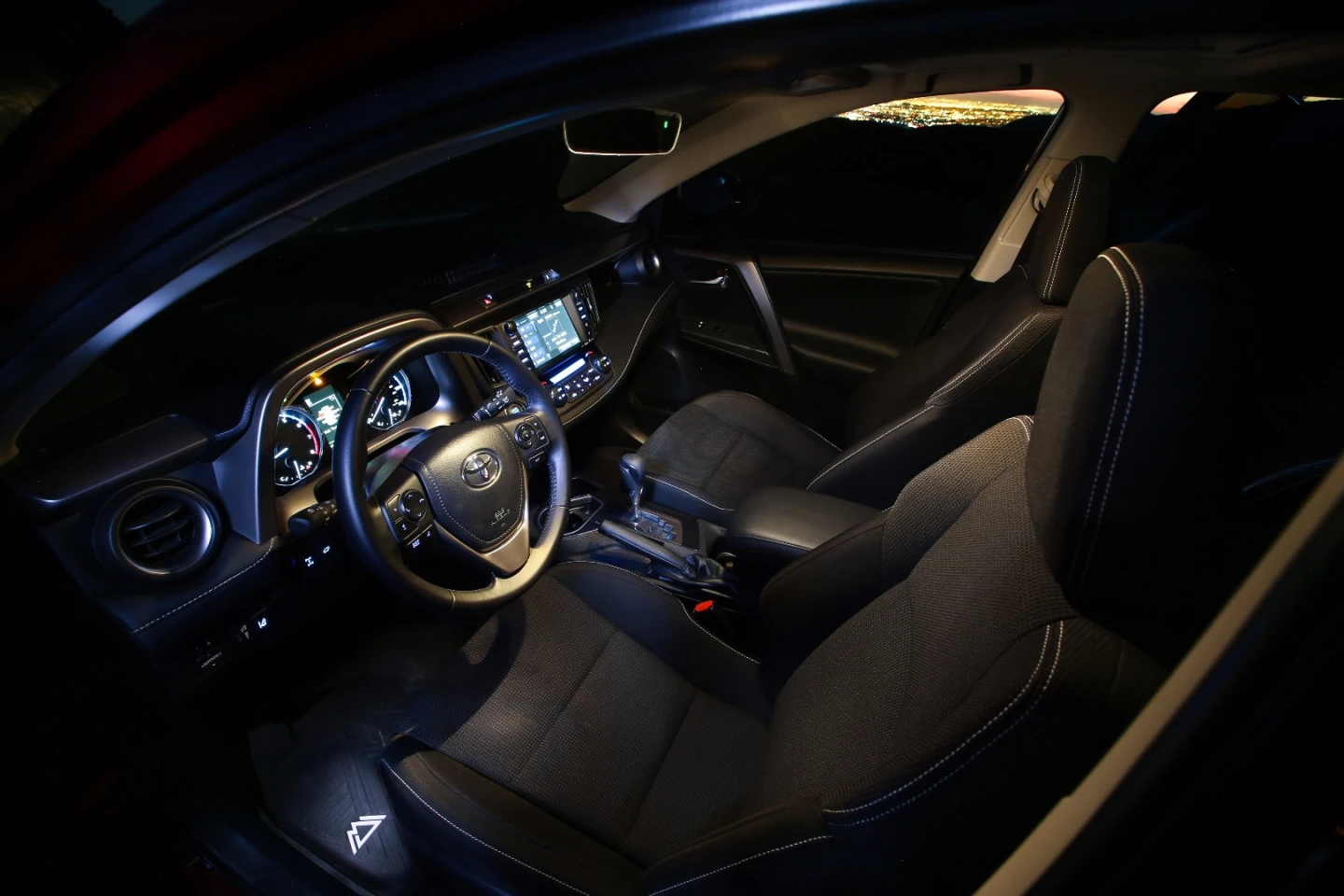 The interior includes a leather-wrapped shift knob, floor mats and other small upgrades