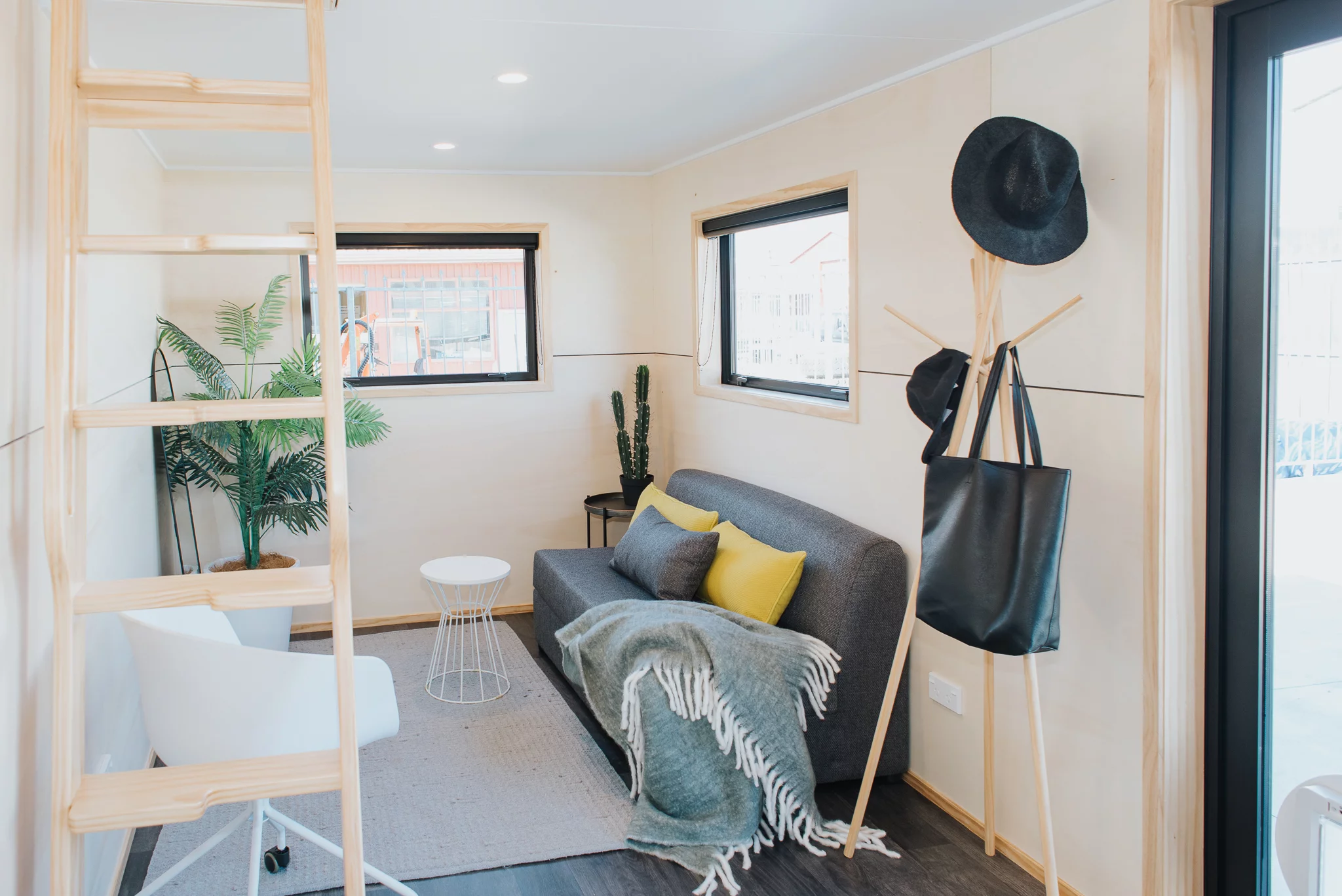 The Dreamweaver Tiny House's living room includes a sofa
