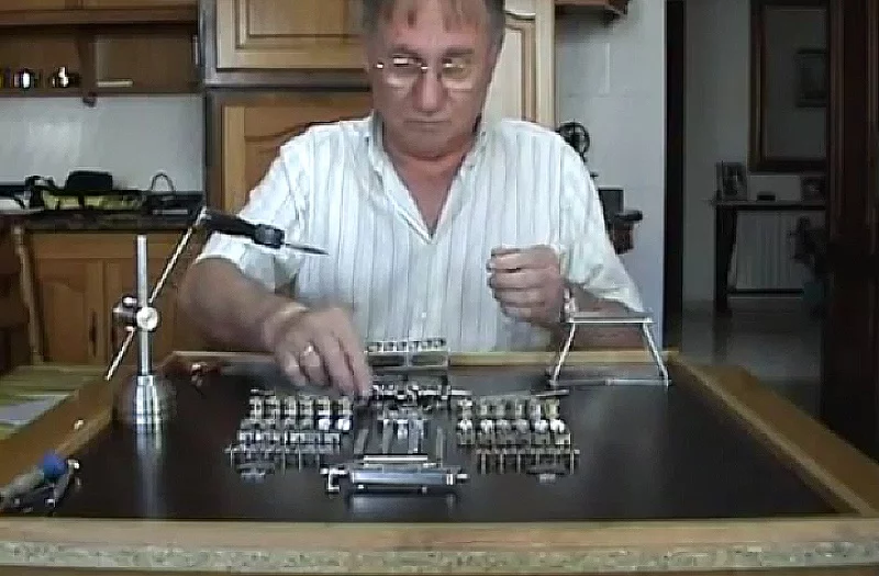 Patelo begins to assemble his tiny V12 engine