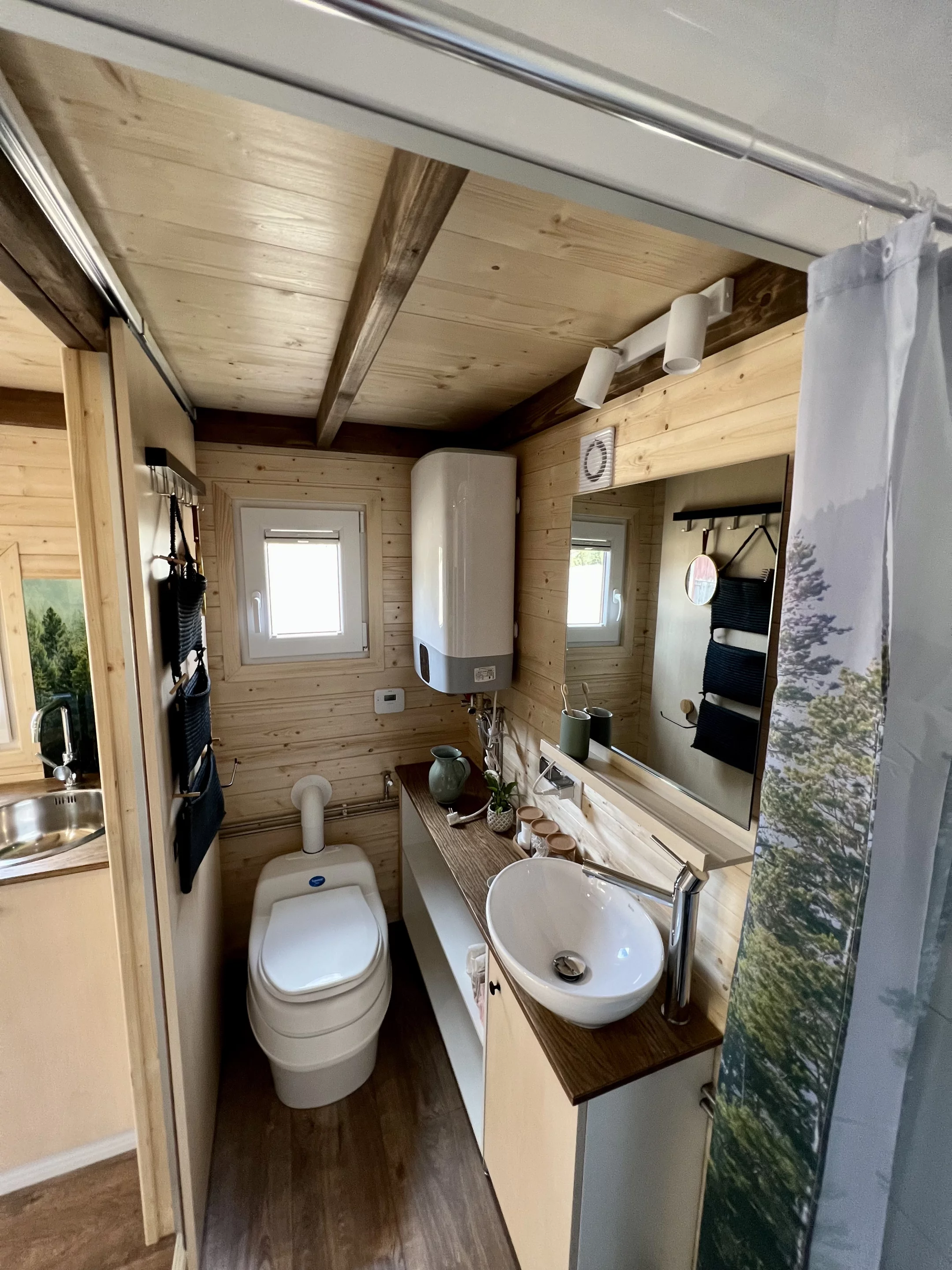 The Sunshine tiny house's toilet can be a composting, flushing, or incinerating model