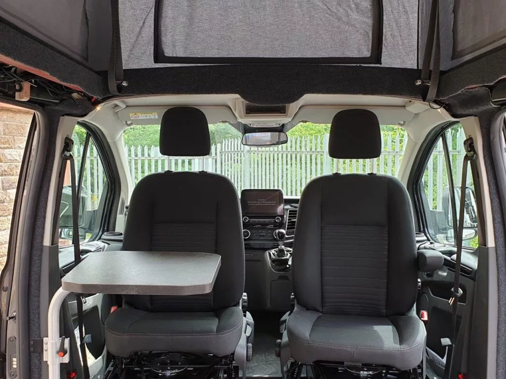 The swivel seats come standard, and the attached table is an option