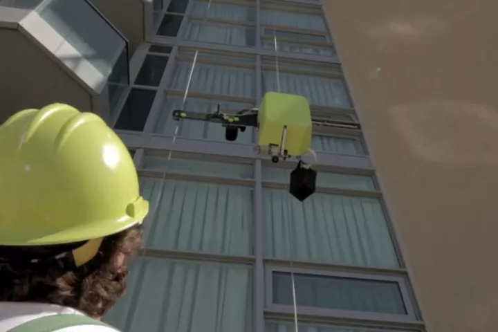 SAM ascends a building