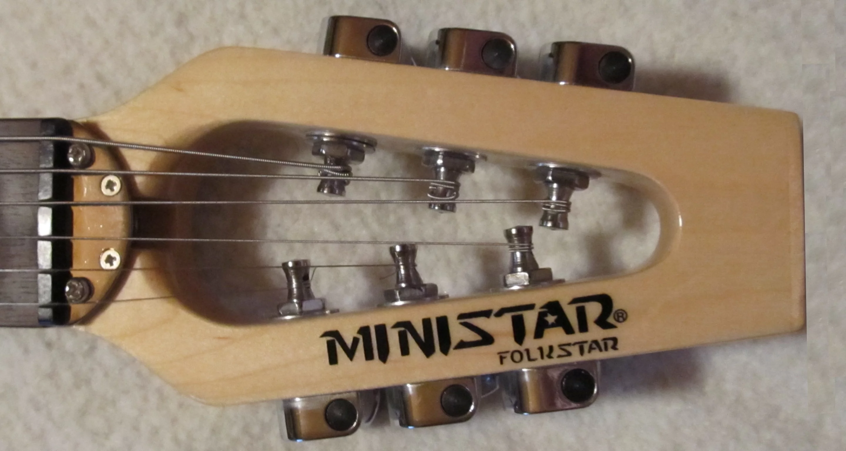 The unique Ministar head featuring die cast metal machine heads and precision tuners that's claimed to give the guitars better sustain and more strength than the industry big boys